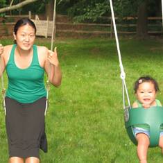Peggy & Hannah in green & on swings - 2007