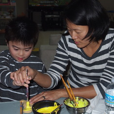 Brevin & Peggy painting cookies together - Oct 2012