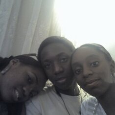 Peter with his sisters, Iserena and Ajoke.