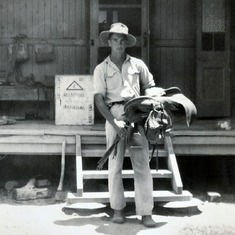 1954 - Peter with his saddle at Callandoon Station in Queensland.