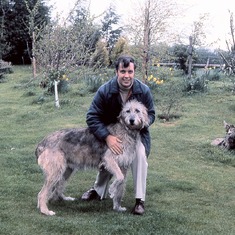 1979-05 - Peter playing with his sisters dog while on holidays in the UK.