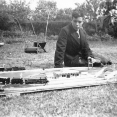 1951 - Peter playing with his train set at 'White Cottage' in Nettleton, Whiltshire.
