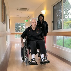2014-08-09 - Peter taking his new wheelchair for a spin around the corridors at Stretton Gardens.