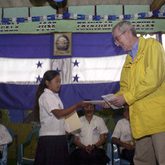 Honduras Peter giving award to school girl 1