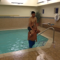 Peter loved hotel pools. Here Joe is carrying Peter on his shoulders. 