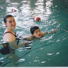 Peter loved to swim. Here he is with his elementary school aide, Sarah Loring.