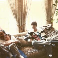 Peter, giving Jason a dose of "worm finger" at Christmas w/ Johnny watching 80s