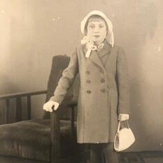Gloves, purse, bonnet, coat...mom's fashion sense started early. 