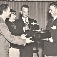 Young Dance Studio Phil receives award circa 1950s
