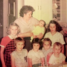 mom and her seven baby dolls