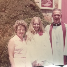 mom and dad with Jill at her confirmation