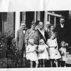 Phyllis's Dad, Mom, Grandma Flint, Grandpa Flint, Esther Flint, Ted Flint. Front row, Phyllis and sisters, Anne Burnett Flint