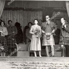 Queen Elizabeth and the Duke of Edinburgh wearing kilts September 1954 at Braemar Games