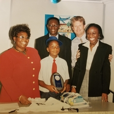 Dad &  Mum with Toks receiving his award from KLM in the Christmas Card Art Competition~ Lagos 2003