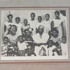 Dad with his mum, aunt, grand ma, siblings and cousins before traveling abroad.