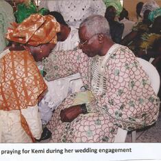 Daddy praying for Kemi at her engagement