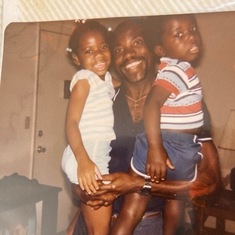 A loving father with his children Bola and Tayo