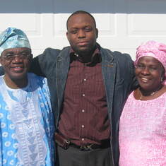 Pre-wedding. Headed to church. Parents of the bride with Bode Ojo, family friend. 2006.