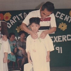 Robert receiving an award in First Grade in Manila, Philippines, 3/15/91.
