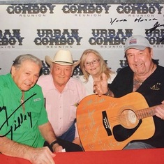 Having his guitar signed by Mickey Gilles and Johnny Lee