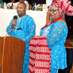 Mr Wilfred ALiu Otokiti delivering his tribute to his mother (Queen Mama Eniyemamwen Aliu-Otokiti), and beside him is his wife- Mrs Patience ALiu Otokiti