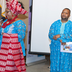 Mrs Patience ALiu Otokiti delivering her tribute to Queen Mama Eniyemamwen Aliu-Otokiti( her mother in law). Behind her is her husband Mr Wilfred Aliu Otokiti