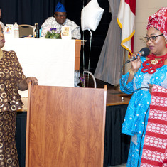 Mrs Patience ALiu Otokiti delivering her tribute to Queen Mama Eniyemamwen Aliu-Otokiti( her mother in law). Watching is Mrs. Ronke Ayeni (MC)
