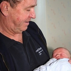 Grandpa Ratch with newborn Shane.