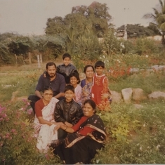 Mummy with grandchildren at picket garden