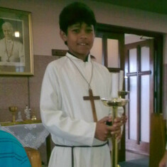 Alter boy for his sisters first holy communion