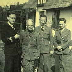 Ray and his father and brothers in uniform
