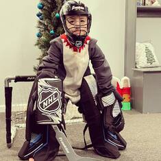 Levi thinks he plays Hockey. love this lil guy