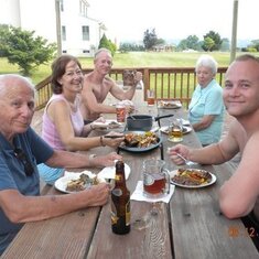 Enjoying a repast at son Rick's home.