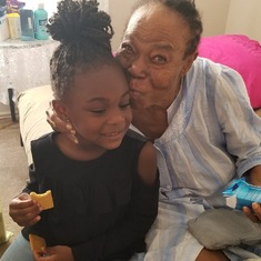 Mama sharing biscuit with great grand-daughter, Khloe