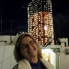 Standing in front of the Queen Mary, on one of the many adventures Rebecca took with her husband Richard