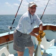 Off the coast of  Biloxi MS. No woman could be happier than Rebel after a 40 minute battle to land a 40 lb. Crevalle Jack.