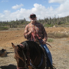 Jim horseback riding along the shore in Aruba.