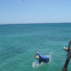 Jim swimming ashore from the Pirate Ship in Aruba followed by Jessica.  Two peas in a pod.