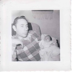 This is Dad with daughter Colleen, March 1957.  Note on the back states "no sleep for awhile".