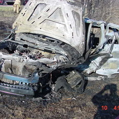 The offender's vehicle, from which she was rescued before it caught on fire.