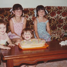 1981.Happy 1st Birthday Richard, with sisters Michelle,Leanne & Andrea.Richard's great-grandmother made the birthday sponge cake. His big party with family & friends was a few weeks earlier.