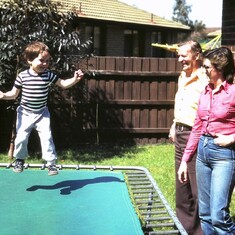 1983 Richard was always on the go. Never one to sit still. Trampolining watched by his grandpa Harry & mum Christine. He also climbed fences or trees, or onto the 2nd storey roof of our home