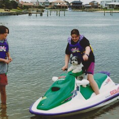 1997. Richard with his sister Andrea and his dog Gizmo on the family jetski.