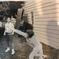 Ricky as a teenager, playing badmitton in our backyard on Ferris Ave in Utica. Fun times.