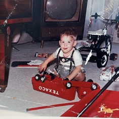 Young Rick at our paternal Grandmother’s for Christmas! I remember playing with that truck many yrs later.