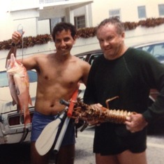 Dad and Roberto after a successful sea hunt