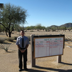 Brother Greg at the entrance 
with schedule for service.