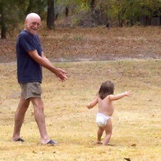 Gpa and Bailey playing in the sprinkler!