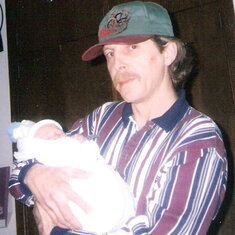 This is Richard holding his first grandson Braydon on the day he was born, February 18, 1999.