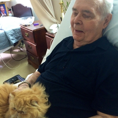 Richard at nursing home with visit from Heidi's cat TJ.